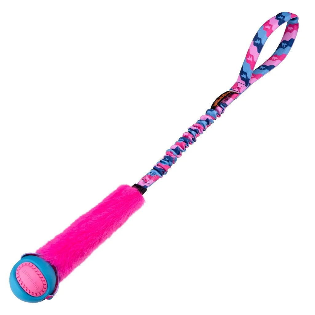 Pink Fauxtastic PowerBall Bungee Tug dog toy combining vibrant faux fur, a blue‑flecked PowerBall dogs see best, and a long bungee handle for dynamic recall rewards